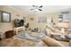 Comfortable living room featuring plush seating, a ceiling fan, and a cozy atmosphere at 10183 Winding River Rd, Punta Gorda, FL 33950