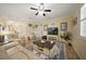 Well-lit living room with comfortable seating, decorative elements, and a calming ambiance at 10183 Winding River Rd, Punta Gorda, FL 33950