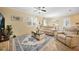 Spacious living room with neutral decor, tile flooring, and plenty of natural light at 10183 Winding River Rd, Punta Gorda, FL 33950