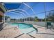 Inviting screened-in pool area with a uniquely shaped pool and ample space for outdoor seating and relaxation at 10183 Winding River Rd, Punta Gorda, FL 33950