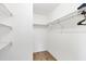 Spacious walk-in closet with ample shelving for storage at 10299 Willmington Blvd, Englewood, FL 34224