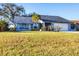 Charming single-story home with a well-maintained lawn and inviting curb appeal at 10299 Willmington Blvd, Englewood, FL 34224
