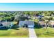 Charming single-story home with well-maintained lawn, palm tree and inviting curb appeal at 10299 Willmington Blvd, Englewood, FL 34224