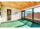 Screened-in porch with wooden ceiling and a view of the backyard at 10299 Willmington Blvd, Englewood, FL 34224
