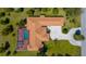 Aerial view of a large private home with an oversized screened in pool at 103 Mecca St, Port Charlotte, FL 33954