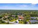 Aerial view of a home on a large treed lot at 103 Mecca St, Port Charlotte, FL 33954