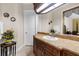 Bathroom vanity with granite countertop, white door and sink. Nice cabinet details at 103 Mecca St, Port Charlotte, FL 33954