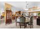Cozy dining room with elegant table setting and decorative china cabinet adjacent to kitchen at 103 Mecca St, Port Charlotte, FL 33954