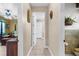 Hallway view connecting the bedroom and bathroom, showcasing the home's layout and flow at 103 Mecca St, Port Charlotte, FL 33954