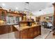 Gourmet kitchen boasts wooden cabinets, granite countertops, and a kitchen island with bar seating at 103 Mecca St, Port Charlotte, FL 33954