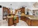 Spacious kitchen with custom wood cabinets, granite countertops, and stainless steel appliances at 103 Mecca St, Port Charlotte, FL 33954