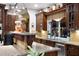 Custom kitchen featuring wood cabinets, granite countertops, tiled backsplash and stainless steel appliances at 103 Mecca St, Port Charlotte, FL 33954