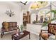 Comfortable sitting area with tile floors, columns, and glimpses into other areas of the home at 103 Mecca St, Port Charlotte, FL 33954