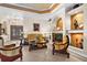 Elegant living area with coffered ceiling, fireplace, comfortable seating, and grand double doors at 103 Mecca St, Port Charlotte, FL 33954