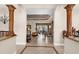 Open living area showcasing tile floors, columns, and a seamless transition to the dining space at 103 Mecca St, Port Charlotte, FL 33954