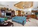 Open-concept living room shows a blue sofa, a flat-screen TV, and an ornate built-in cabinet for storage and display at 103 Mecca St, Port Charlotte, FL 33954