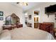Serene main bedroom with neutral colors, with a glimpse into the attached bathroom and living area at 103 Mecca St, Port Charlotte, FL 33954