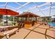 Outdoor kitchen featuring a large serving bar and plenty of seating at 103 Mecca St, Port Charlotte, FL 33954
