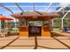 Outdoor kitchen featuring stainless steel appliances and lots of bar seating at 103 Mecca St, Port Charlotte, FL 33954