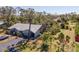 Aerial shot of the well-manicured townhomes surrounded by mature trees at 107 Jose Gaspar Dr, Englewood, FL 34223