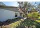 The back yard is shaded with tropical vegetation at 107 Jose Gaspar Dr, Englewood, FL 34223