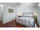 Comfortable bedroom featuring hardwood floors and ample natural light at 107 Jose Gaspar Dr, Englewood, FL 34223