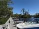 Community boat dock with boat, providing convenient access for waterfront adventures at 107 Jose Gaspar Dr, Englewood, FL 34223