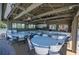 Bright, open community center space with tables and chairs for social gatherings and activities at 107 Jose Gaspar Dr, Englewood, FL 34223
