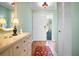 Welcoming entryway with hardwood floors, a decorative dresser, and a view of the front door and outside at 107 Jose Gaspar Dr, Englewood, FL 34223