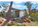 Charming home with mature landscaping and a cozy front porch entrance at 107 Jose Gaspar Dr, Englewood, FL 34223