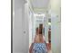 Hallway featuring hardwood floors and access to multiple rooms at 107 Jose Gaspar Dr, Englewood, FL 34223