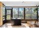 Screened-in lanai with dining area and views of the landscaped yard at 107 Jose Gaspar Dr, Englewood, FL 34223