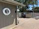 Well-maintained poolside amenities including a life preserver, shower, and outdoor grill at 107 Jose Gaspar Dr, Englewood, FL 34223