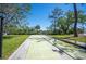 Outdoor shuffleboard courts provide a fun recreational activity in a beautifully landscaped setting at 107 Jose Gaspar Dr, Englewood, FL 34223