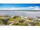 A waterfront houses feature lush lawns and views of the river from above at 12605 Bacchus Rd, Port Charlotte, FL 33981