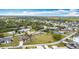 Residential neighborhood with beautiful homes and lush greenery, surrounded by trees at 12605 Bacchus Rd, Port Charlotte, FL 33981