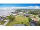 Aerial view of waterfront houses and tree lined streets in this desirable community at 12605 Bacchus Rd, Port Charlotte, FL 33981