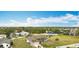 Home exterior with two car garage in residential area with lush landscaping at 12605 Bacchus Rd, Port Charlotte, FL 33981