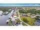 Waterfront neighborhood with a blend of residential homes surrounded by lush trees at 12605 Bacchus Rd, Port Charlotte, FL 33981