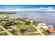 Aerial view features waterfront houses and private boat docks in a coastal community at 12605 Bacchus Rd, Port Charlotte, FL 33981