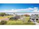 Waterfront homes feature lush lawns and beautiful scenery on a sunny day at 12605 Bacchus Rd, Port Charlotte, FL 33981