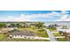 Aerial view of neighborhood and home featuring a large lot with manicured landscaping at 12605 Bacchus Rd, Port Charlotte, FL 33981