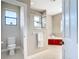 A modern bathroom with a glass shower, soaking tub, and neutral tile at 12605 Bacchus Rd, Port Charlotte, FL 33981