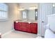 Primary bathroom features double sink vanity, granite countertops, and a large mirror at 12605 Bacchus Rd, Port Charlotte, FL 33981