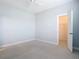 Empty bedroom with neutral carpet, ceiling fan, and large closet at 12605 Bacchus Rd, Port Charlotte, FL 33981