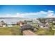 Beautiful aerial view of waterfront homes with lush green lawns and wonderful water views at 12605 Bacchus Rd, Port Charlotte, FL 33981