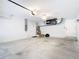 Spacious garage featuring concrete flooring and a ceiling fan at 12605 Bacchus Rd, Port Charlotte, FL 33981