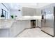 Bright kitchen features granite counters, stainless steel appliances, and light gray cabinets at 12605 Bacchus Rd, Port Charlotte, FL 33981