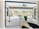 Relaxing screened lanai with ceiling fan, and furniture overlooking pool and landscaped backyard at 12605 Bacchus Rd, Port Charlotte, FL 33981