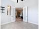 Bright office space with french doors and neutral tile flooring throughout the home at 12605 Bacchus Rd, Port Charlotte, FL 33981